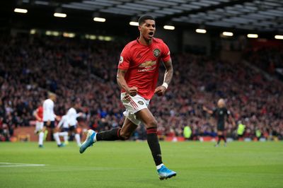 a man running on a soccer field during a game