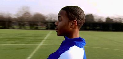 a man standing on top of a soccer field