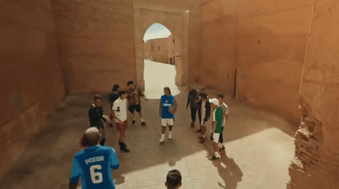 a group of people walking through a tunnel