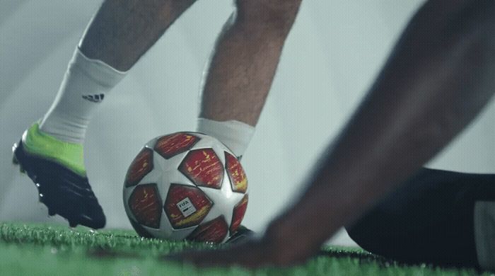 a close up of a person holding a soccer ball