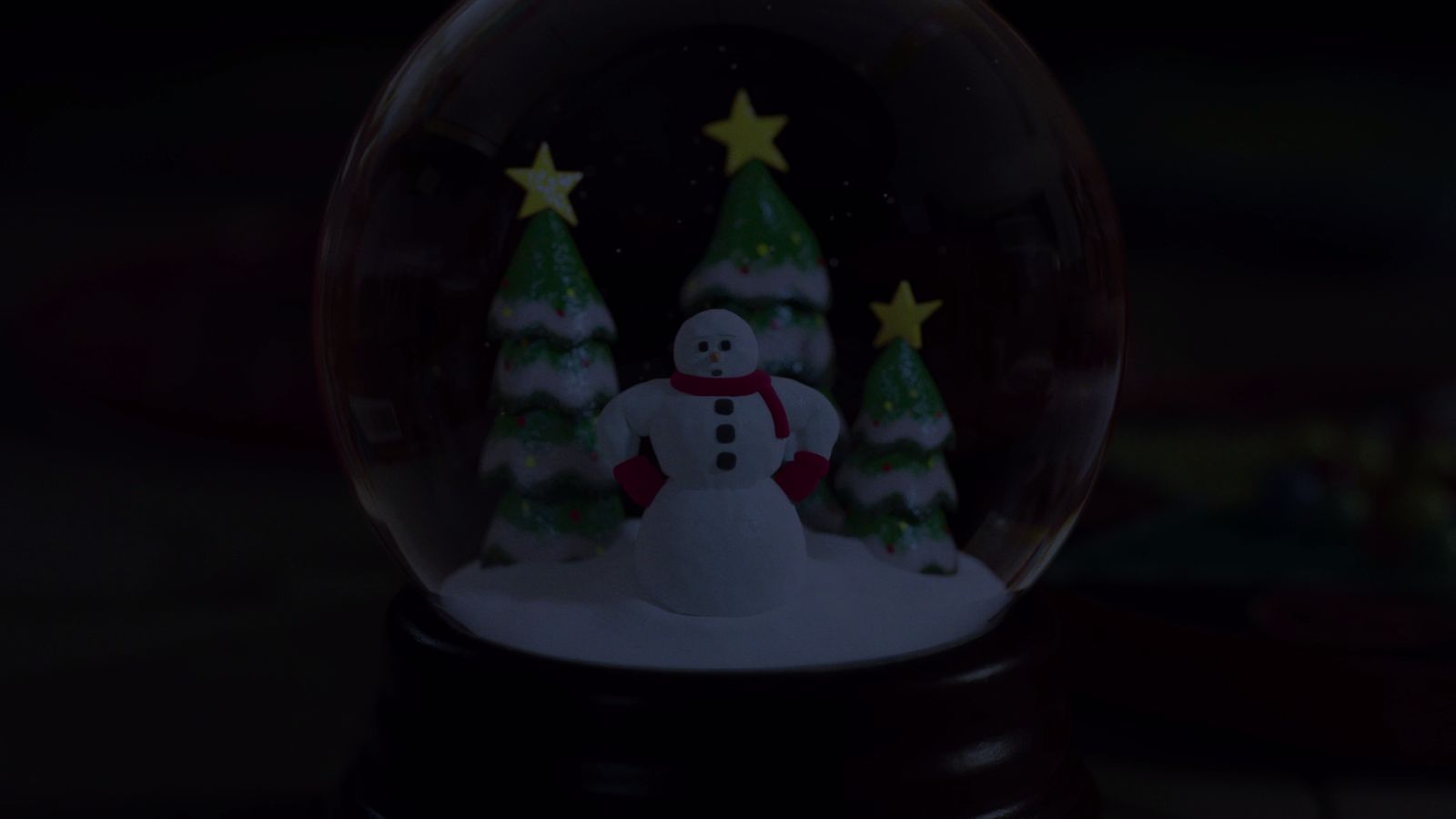 a snow globe with a snowman inside of it