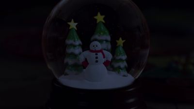 a snow globe with a snowman inside of it