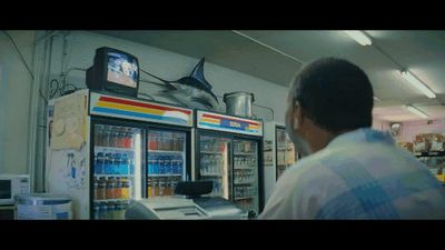 a man standing in front of a vending machine