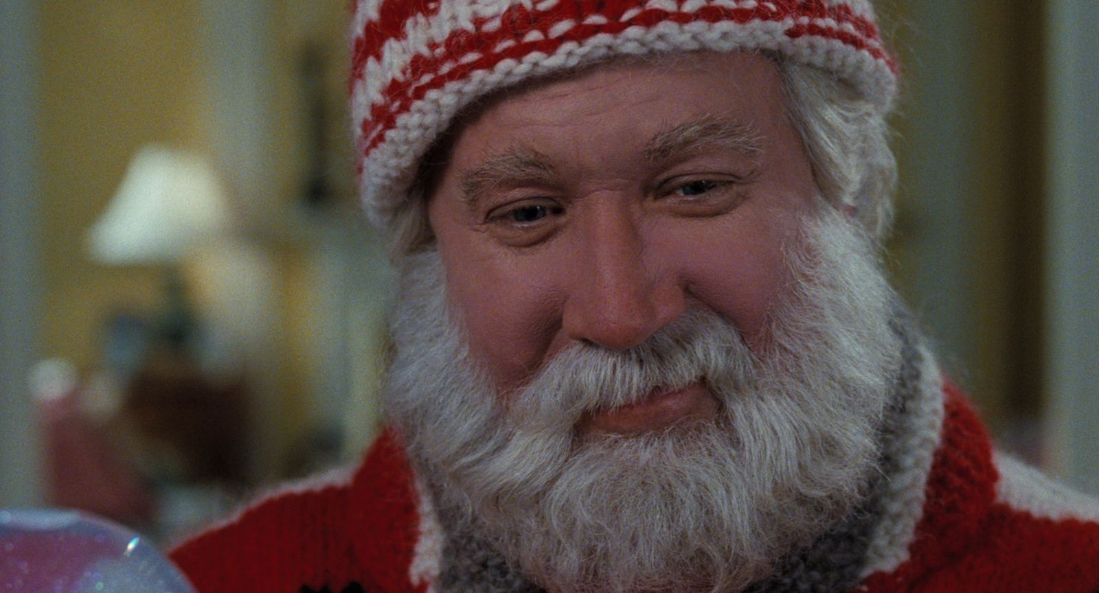 a close up of a person wearing a santa hat