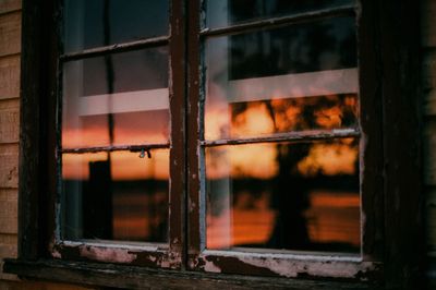 a close up of a window with a person in the background