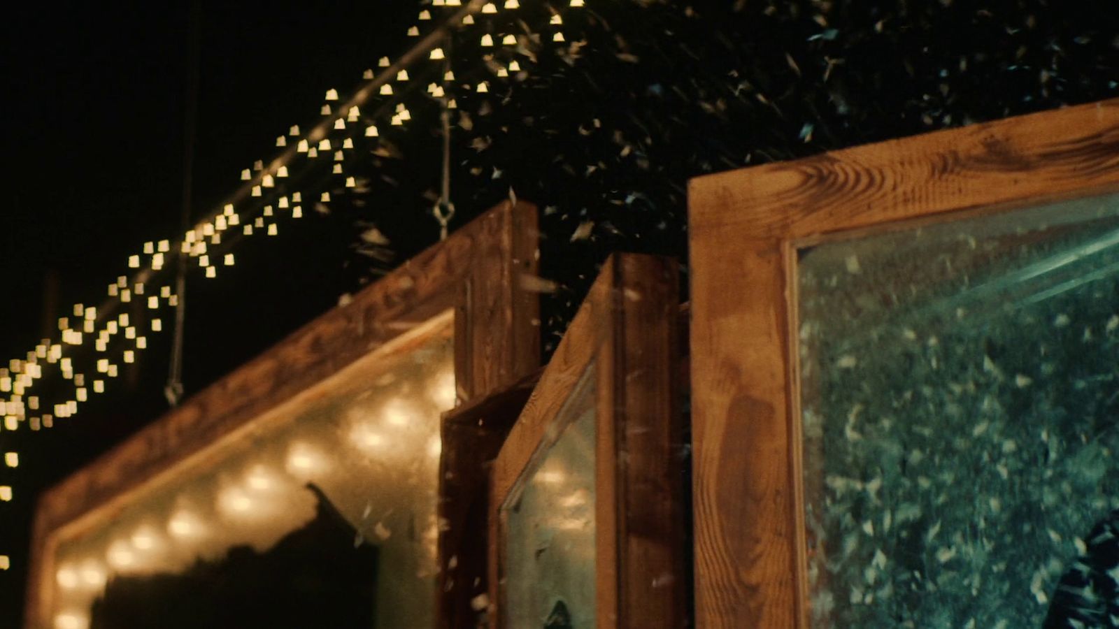 a string of lights hanging from the ceiling of a building