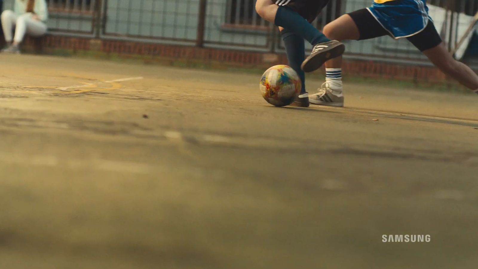 a group of people playing a game of soccer