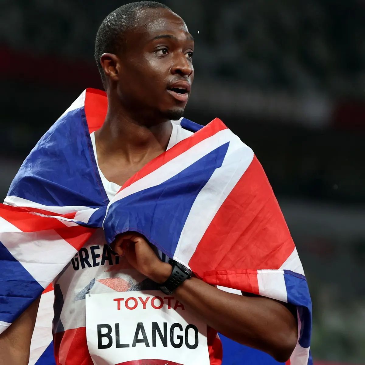 a man holding a flag in his hands