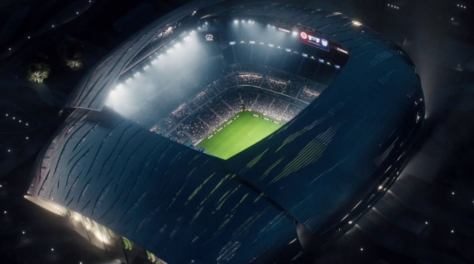 an aerial view of a soccer stadium at night