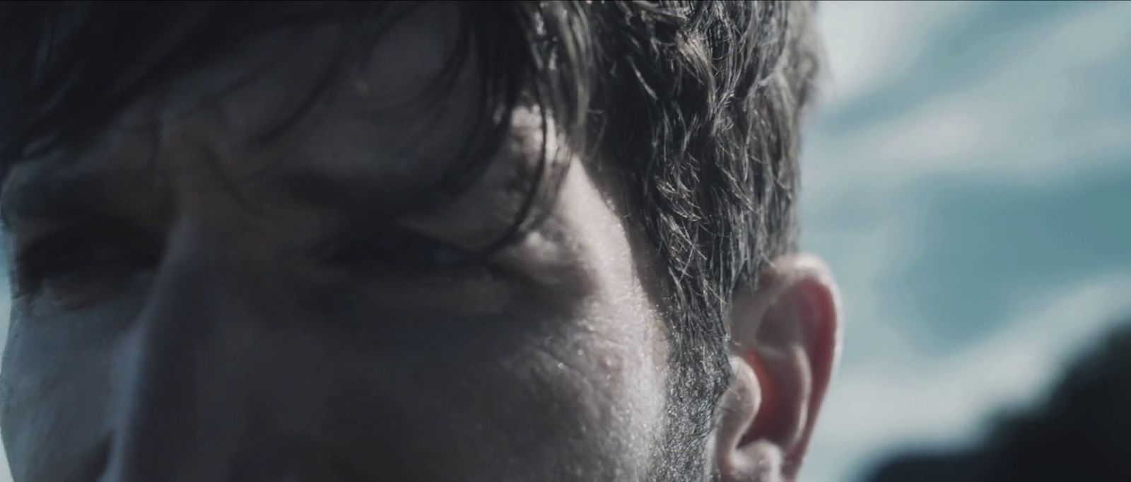 a close up of a man's face with a blurry background