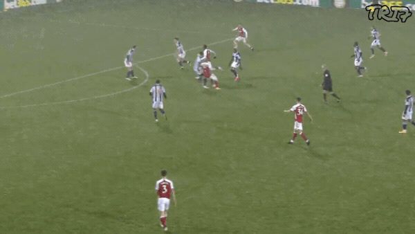 a group of men playing a game of soccer