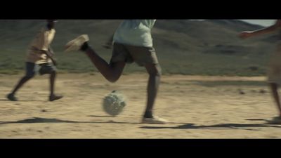 a group of young men kicking around a soccer ball