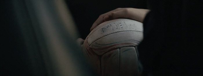 a person holding a basketball in their hand