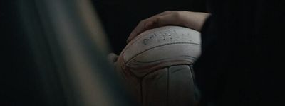 a person holding a basketball in their hand