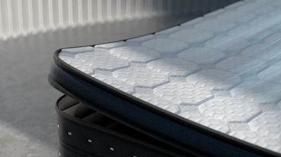 a close up of a mattress on a bed frame