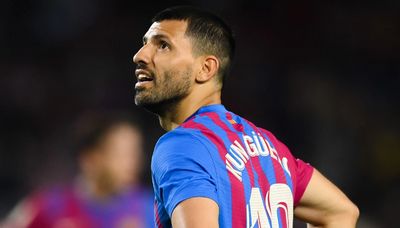 a close up of a soccer player with a serious look on his face