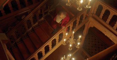 a person standing on a stair case in a building