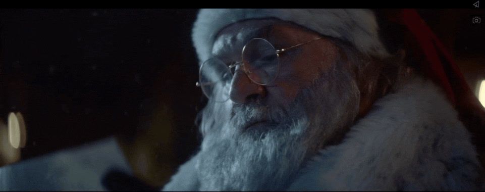 a man wearing a santa claus hat and glasses