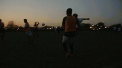 a group of young men playing a game of frisbee