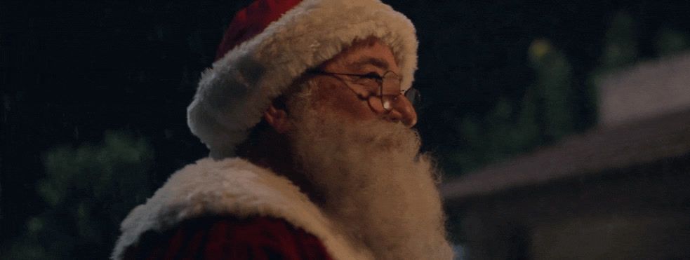 a man wearing a santa claus hat and glasses