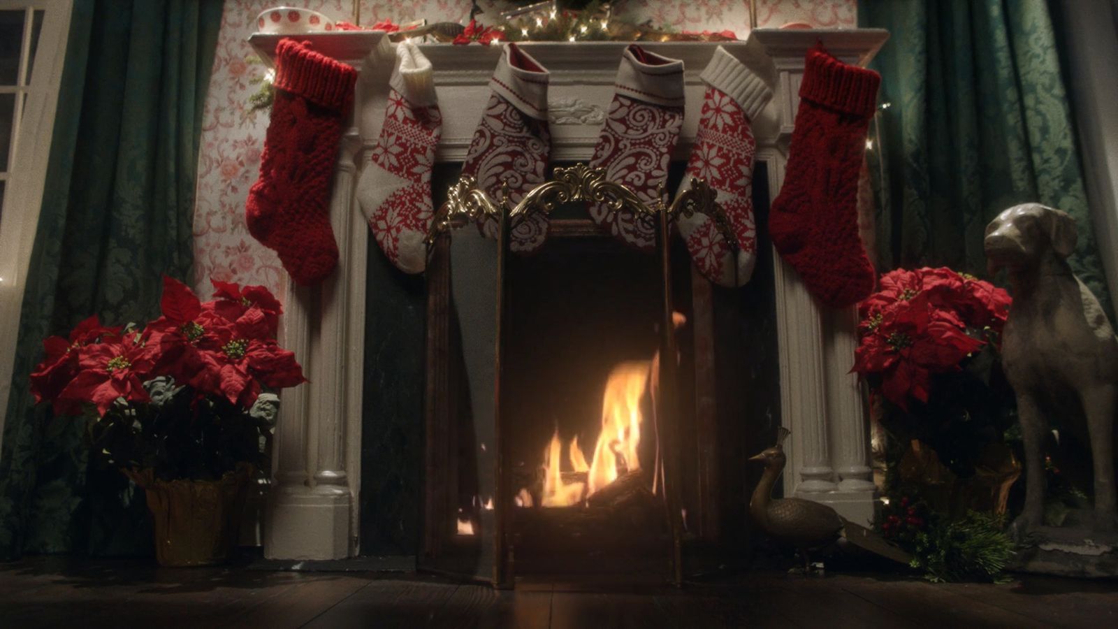 a fireplace with stockings and christmas stockings on it