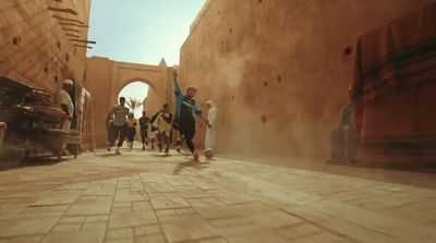 a group of people walking down a street