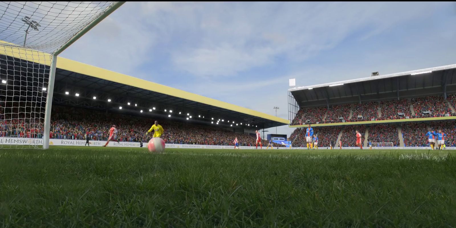 a soccer game is being played in a stadium