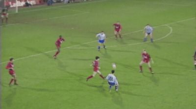 a group of men on a field playing soccer