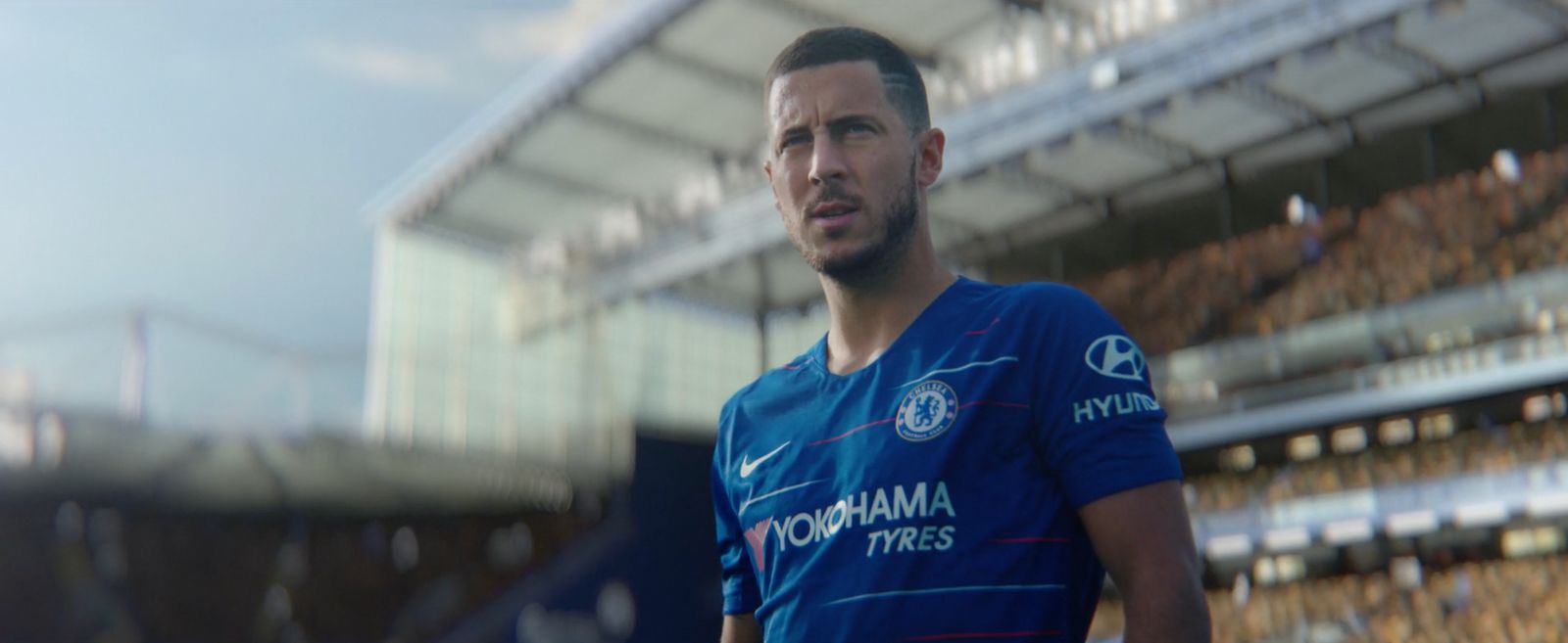 a man standing in front of a soccer stadium