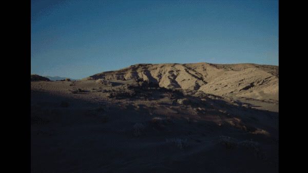 a view of a mountain with a sky background