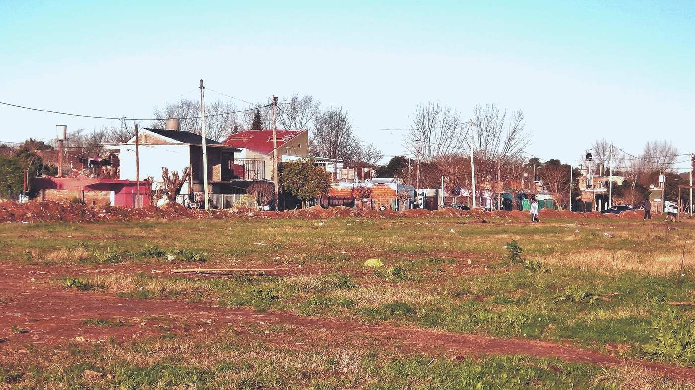 a field that has a bunch of houses in it