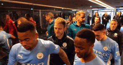 a group of men walking through a locker room