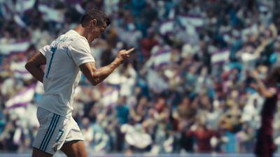 a man standing on top of a soccer field