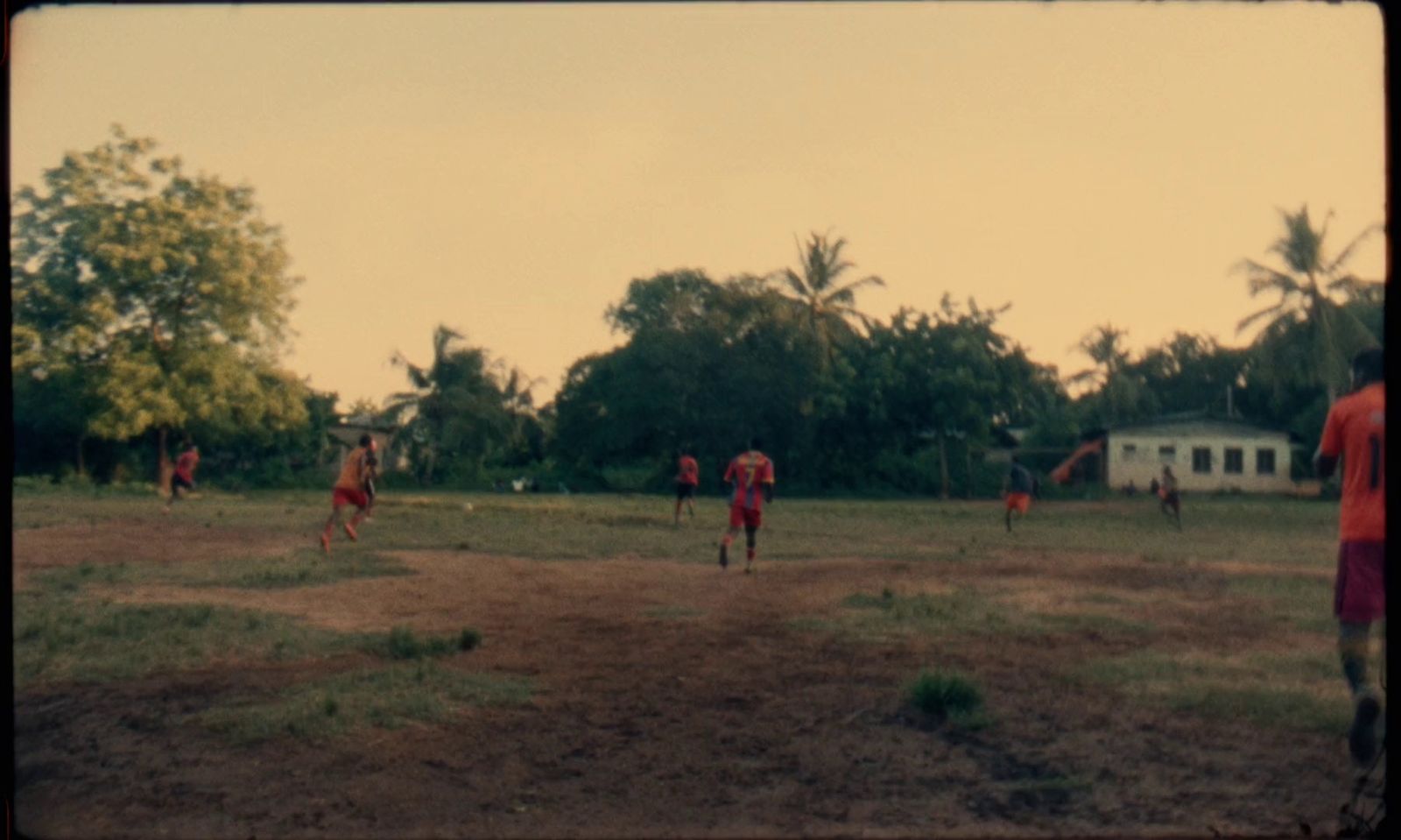 a group of people playing a game of soccer