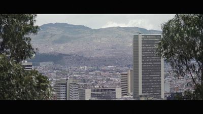 a view of a city with mountains in the background