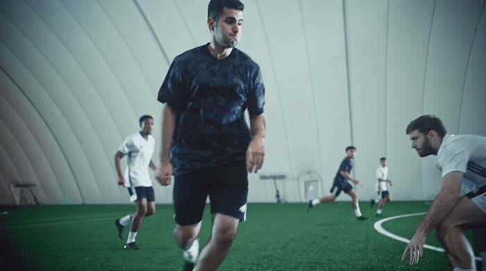 a group of men playing a game of soccer