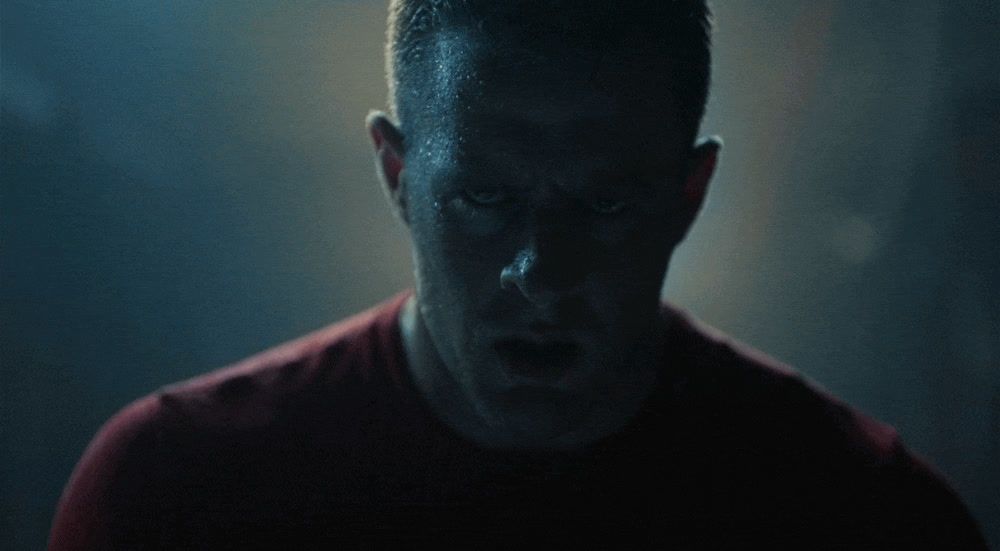 a man making a face in a dark room