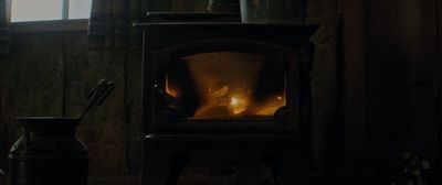 a wood burning stove in a dark room