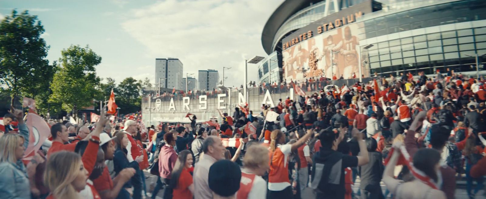 a large group of people standing in front of a building