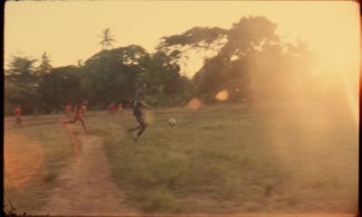 a group of people playing a game of soccer