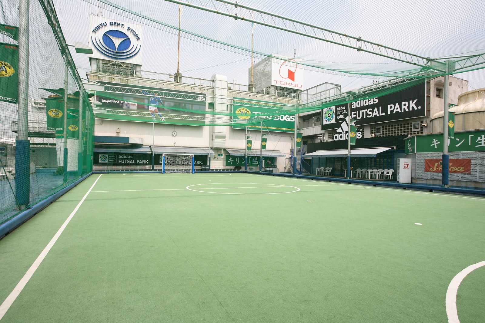 a tennis court with a green and white court