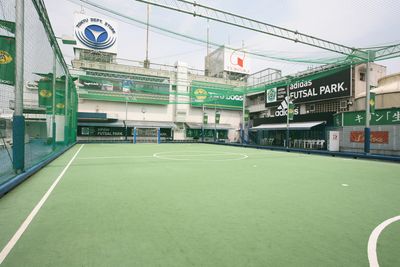 a tennis court with a green and white court