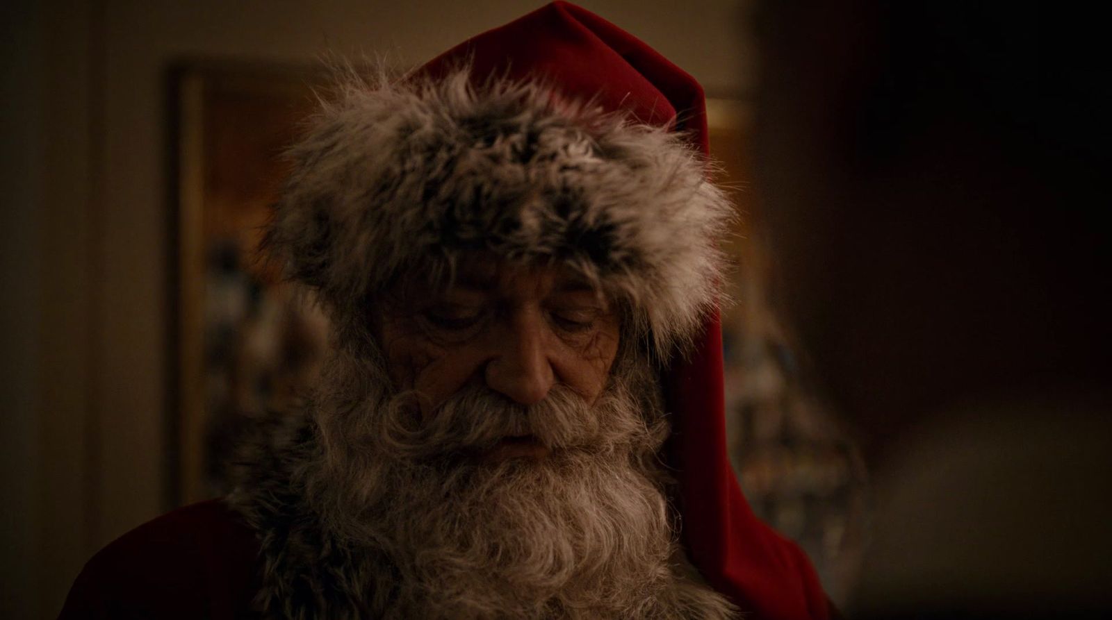 a close up of a person wearing a santa hat