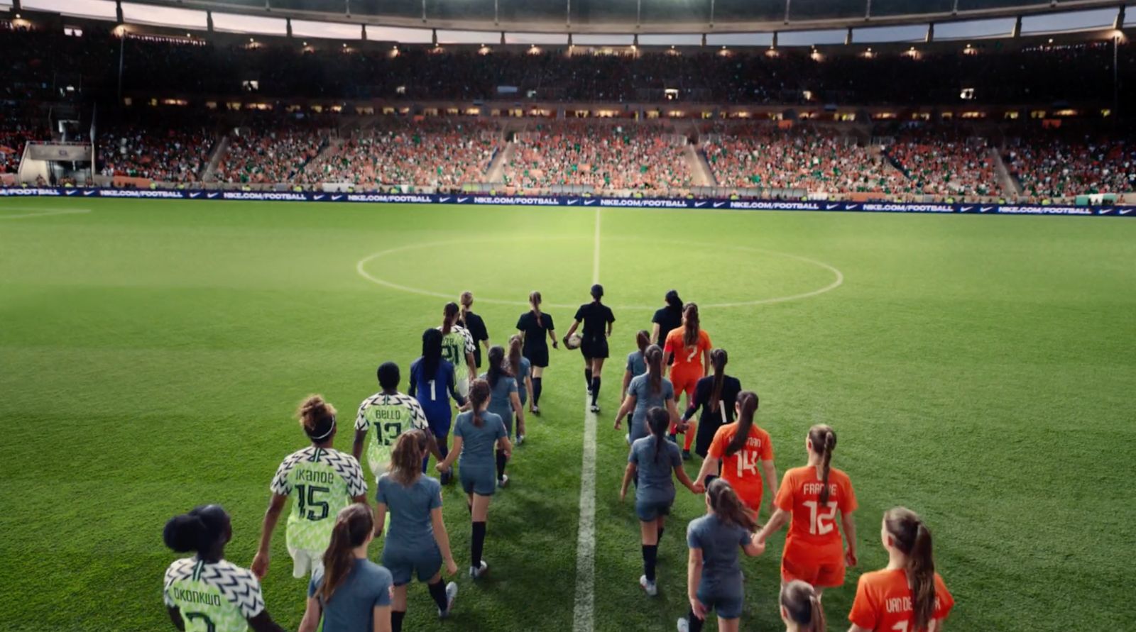 a group of people standing on top of a soccer field