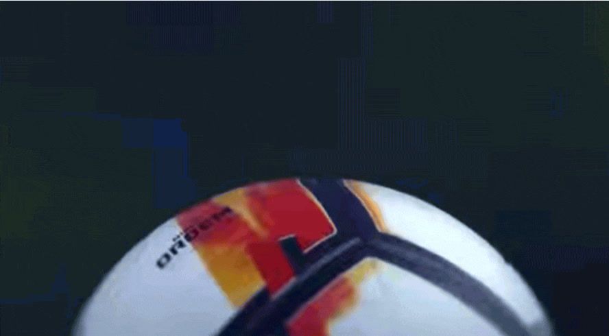 a close up of a soccer ball with a blurry background