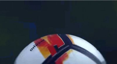 a close up of a soccer ball with a blurry background