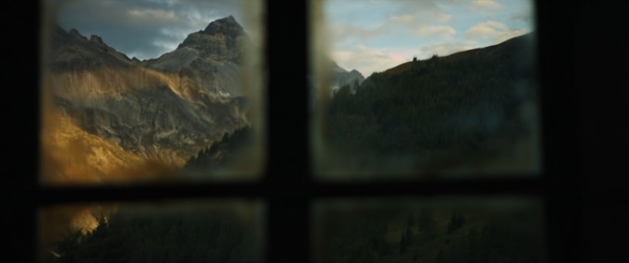 a view of a mountain range through a window