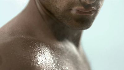 a close up of a man with no shirt on