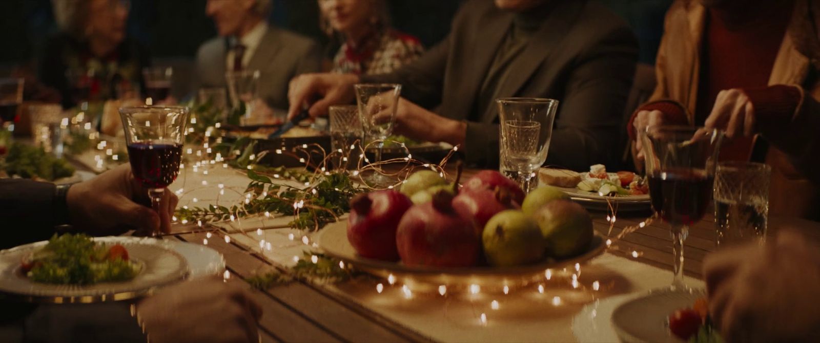 a group of people sitting around a dinner table