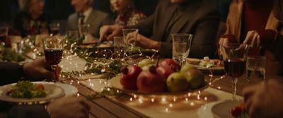 a group of people sitting around a dinner table